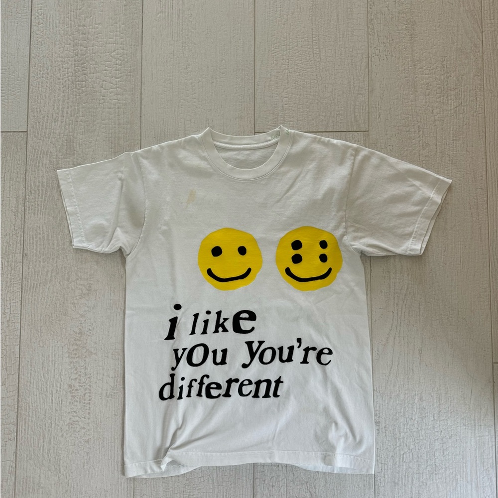 White Short Sleeve Tee with Smiley Face Emojis and Playful Text